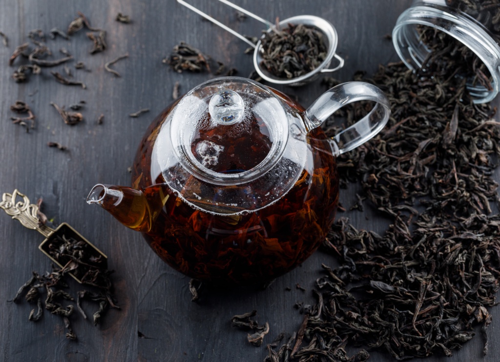 black-tea-with-dry-tea-in-a-teapot-on-wooden-surface.jpg